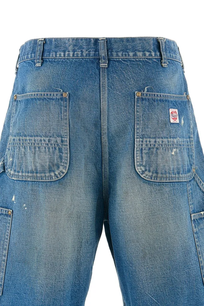 SAINT Mxxxxxx DOUBLE KNEE SHORTS/BLU Knee patches splashed with ink and water-splashed denim shorts. Denim blue S-XL. Custom-woven and dyed denim fabric with clear texture. Heavy-wash water-fading treatment to create local mottled fading/hole effects. Artificial distressing to simulate natural wearing marks. VINTAGE sense. Original consistent damage treatment. Hand-splashed ink and paint. Original consistent wash mark/pocket mark. Double knee patch. Rivet reinforcement. Improve functionality while enhancing design